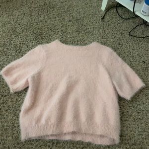 selling a pink  womens sweater size:large